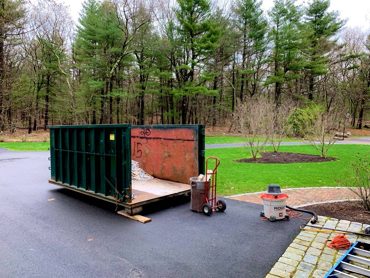 Dumpster with its back door open for walk-in loading