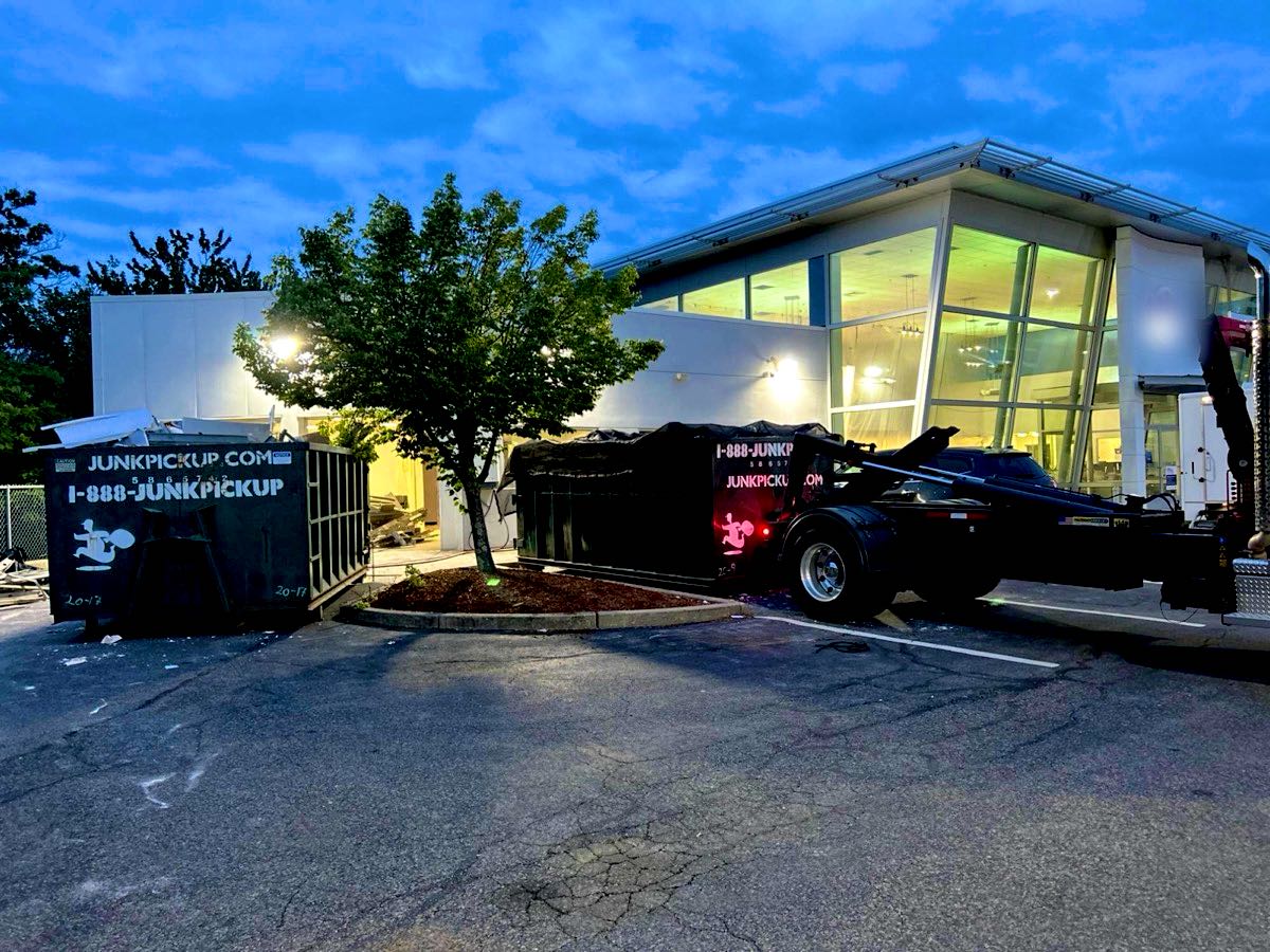 Two roll-off dumpsters at a commercial job