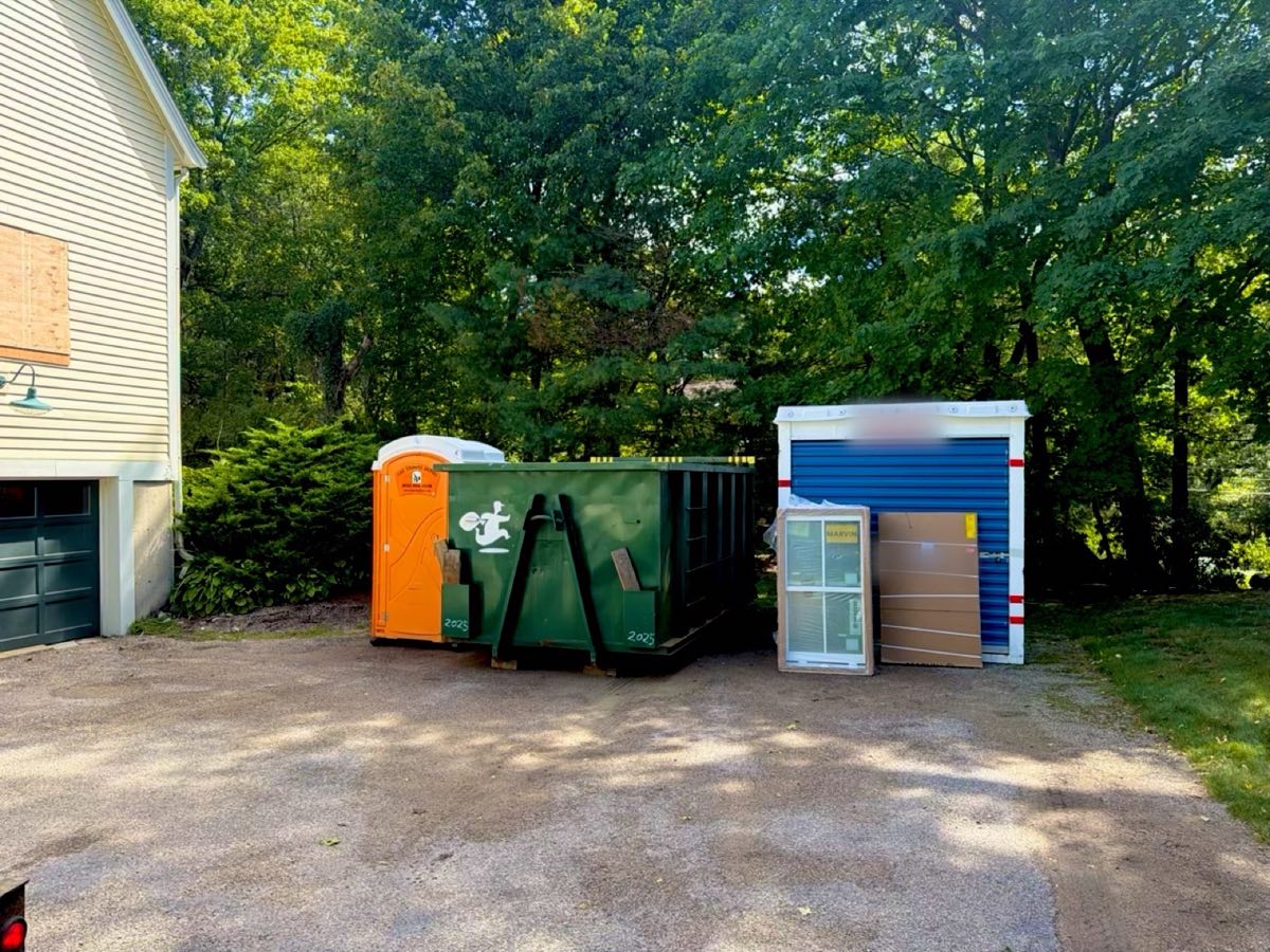 20 yard roll-off dumpster dropped off for a home renovation in Walpole, MA